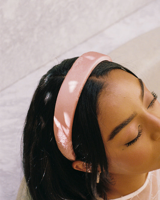 close up of pink satin headband